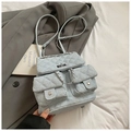 Quilted light blue denim backpack with silver chain straps and flap closure design - Light Blue