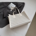 White hollow out tote bag with geometric laser-cut design for minimalist fashion style - White