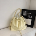 Minimalist light yellow drawstring bucket bag with a matte texture and silver hardware - Yellow Without Pendant