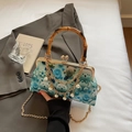 Sky blue crossbody bag with bear print, bamboo handle, and elegant pearl chain detail - Blue