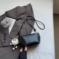 Fashionable black leather pleated crossbody bag with white fur ball and gold hardware - Black With Pendant
