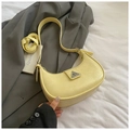 Detail of light yellow crescent bag with pleated texture and triangle metal clasp - Yellow