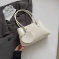 Minimalist beige PU leather shoulder bag with matching heart-shaped coin purse accessory - White