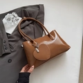 Chic caramel patent leather shoulder bag with a trendy heart-shaped coin purse charm - Brown