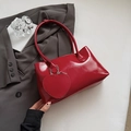 Chic red patent leather shoulder bag for women with matching heart-shaped charm accessory - Red