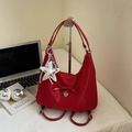Versatile red nylon handbag with ribbon bow and star charm on an aesthetic desk setup - Wine Red With Pendant