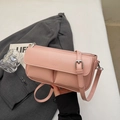 Detail of pink faux leather bag featuring embossed PARIS logo and front dual pockets - Pink