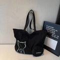 Minimalist black canvas tote bag with green cat outline and matching round mini pouch - Black