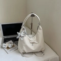 Detail of off-white hobo bag with a silver sequin star charm and heart pendant decorations - Off-white With Pendant
