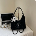 Detail of black satin multi-use bag featuring silk bow and silver star charm accessory - Black With Pendant