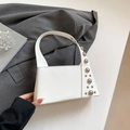 Chic white trapezoid handbag with silver rivet studs and a stylish leather top handle - White
