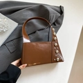Glossy brown rectangle handbag with silver ball studs and polished leather finish - Brown