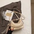 Creamy beige lychee grain leather handbag with woven rope charm and silver hardware - With Pendant / Off White