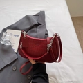 Detail view of red crocodile embossed half-moon bag with silver zipper and brand embossing - Burgundy