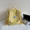 Vibrant yellow canvas backpack with flap closure and white label for casual daily use - Without Pendant / Yellow
