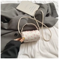 Mini cylinder crossbody bag in cream with pink bow prints and ruffled trim details - White Small