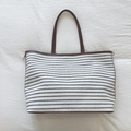 Striped canvas tote bag with brown leather trim and handles in a spacious casual design - Black