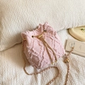 Pink denim bucket bag with frayed quilted pattern and pearl charm strap detail - Pink
