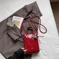 Mini red patent leather bucket bag with silver balloon dog charm and white lettering - Red