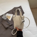 Mini cream bucket bag in textured faux leather with silver rabbit charm for women - Off White