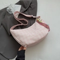 Detail of pink plaid crescent bag featuring embroidery and colorful tassel strap - Pink (With Rainbow Pendant)