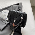 Chic black V-quilted leather crossbody bag with silver chain strap and sphere charm - Black