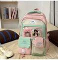 Detail view of pink and mint green nylon backpack with transparent pocket and embroidery - Pink