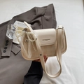 Polka dot underarm shoulder bag in creamy white with pearl bow lace charm - Off-white