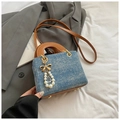 Blue denim texture handbag with brown handles, golden bow and pearl pendant detail - Denim Blue With Pendant