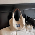 Beige canvas draagtas met blauw TCT-borduurwerk en bruine leren handvatten - Beigegrijs