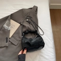 Modern black cloud handbag with pleated handle and metal chain strap on grey blazer - Black without Pendant