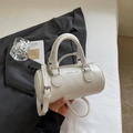 White Boston cylinder handbag with textured PU leather and adjustable shoulder strap - No Pendant / Off White