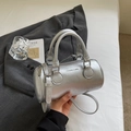 Silver metallic cylinder Boston bag with top handles and adjustable shoulder strap - No Pendant / Silver
