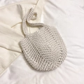 Detailed macro view of the cream white handmade crochet shoulder bag with tight knit texture - White