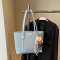 Light blue woven leather tote bag with cute bear charm and branded tag on hanger - Blue with Pendant