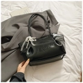 Detail of black patent leather tote with white lace bow and pearl charms decoration - With Pendant / Black