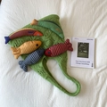 Grass green knit tote bag featuring colorful plush fish charms with tassel accents - Green