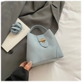 Chic light blue bucket bag with leather patchwork and gold hardware clasp - Light Blue