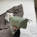 Polka dot underarm bag in light green patent leather with a metallic B decoration - Green