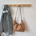 Caramel brown pleated faux leather shoulder bag with knot detail and crescent shape - Brown No Pendant