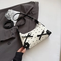 Borsa a spalla bianca con fiocchi neri e tracolla regolabile per donna - Bianco