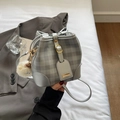 Silver-grey checkered bucket bag with drawstring closure and plush pendant charm - Silver (With Pendant)