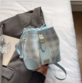Light blue and beige checkered bucket bag with leather trim and drawstring closure - Blue Without Charm
