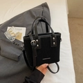 Minimalist black bucket bag with textured surface and adjustable silver buckle strap - Black without Pendant