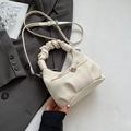 Chic beige checkered mini handbag with bow decor and cloud handle over a grey blazer - Rice White (No Pendant)