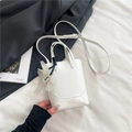 White faux leather tote bag with elegant organza flower charm and long shoulder strap - White With Pendant