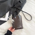 Vertical dark brown glossy tote bag with dual handles and elegant flower charm - Coffee With Pendant