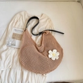 Detail of knit shoulder bag featuring hollow mesh pattern and 3D daisy flower accent - Khaki