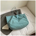 Detail view of a green San Francisco tote bag made of foldable upcycling canvas fabric - Light Blue