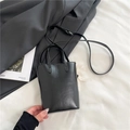 Classic black tote bag with dual handles, adjustable strap and white flower charm - Black without Pendant